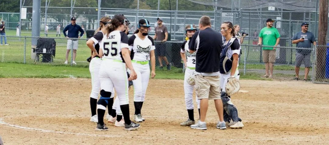 Players on field with coach